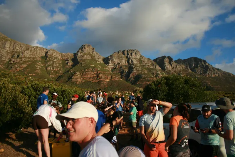 group gathered before the run with mountains in the background
