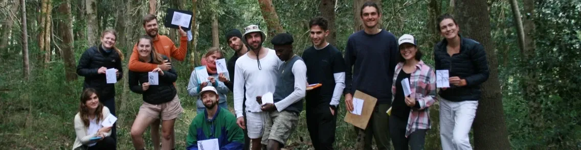 Leopards runners sharing coffee and pastries around a long table after a run
